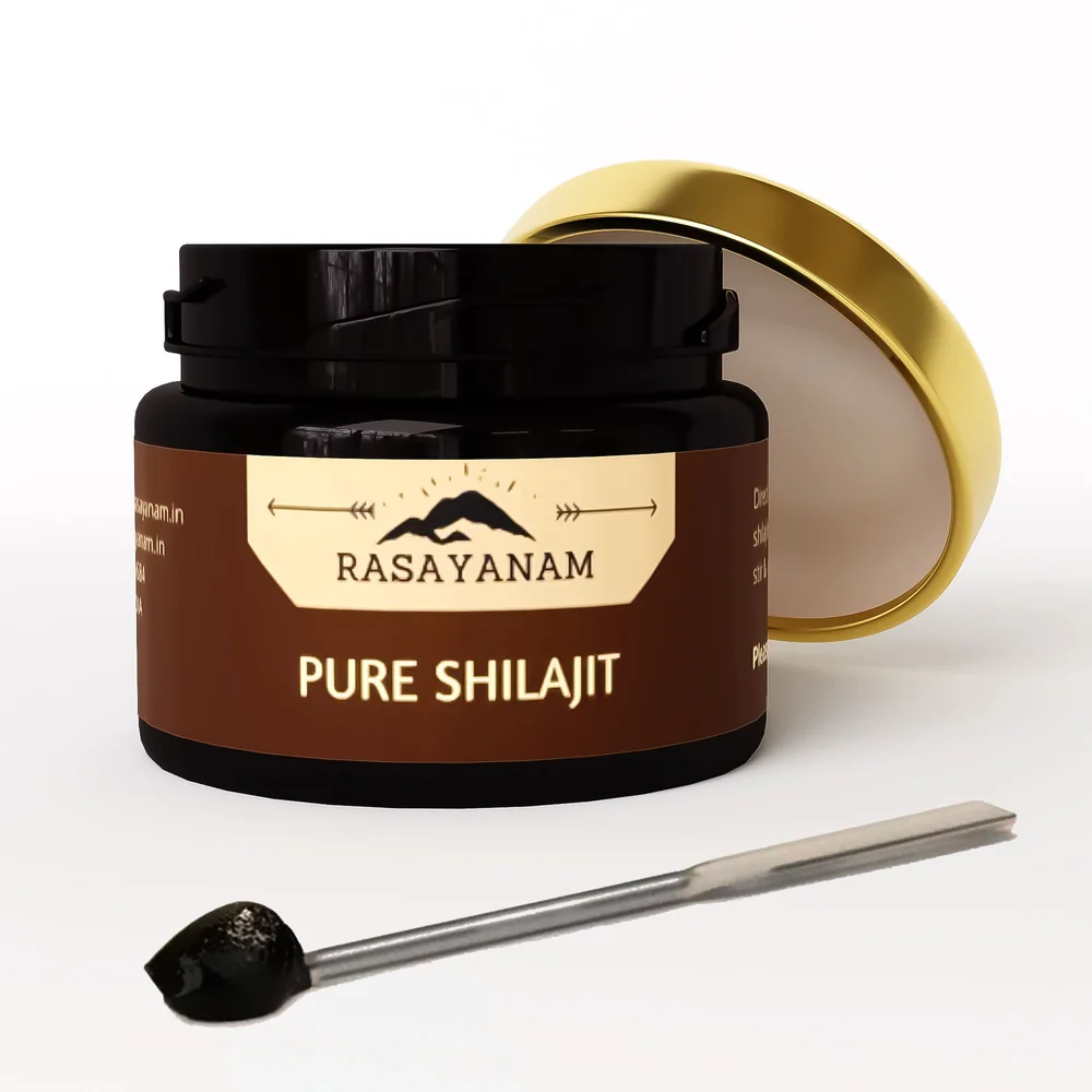3D render of an open Pure Shilajit jar, its gold lid leaning behind it and a spatula in front.